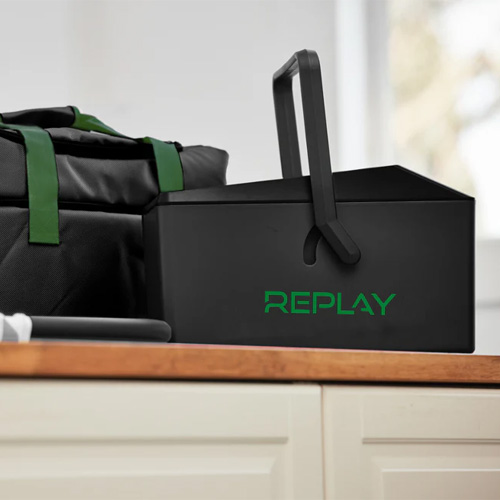 REPLAY ice compression unit and carry bag on a timber benchtop
